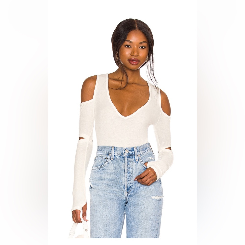 Revolve Top in Ivory  with shoulder and elbow cut-outs